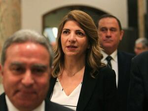 Lebanese Justice Minister Marie Claude Najm, center, cited the catastrophic Beirut explosion as her reason for resigning. (AFP file photo)