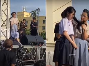 At a recent rally two girls acted out a teacher cutting off a pupil's hair. (TikTok Video Screenshots)