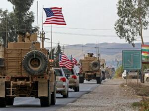 A convoy of US military vehicles withdrawing from northern Syria crossed into Iraqi Kurdistan on Monday (AFP Photo/SAFIN HAMED)
