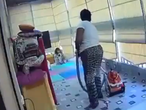 The maid swooped up the child in her arms when the massive explosion rocked their home. (Video Screenshot)