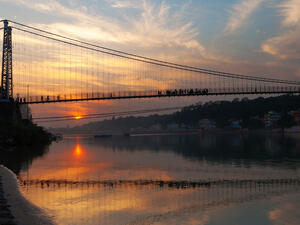 View of River Ganga and Ram Jhula bridge at sunset. Rishikesh. India  (Shutterstock)	
