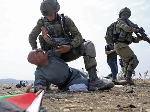 Israeli soldiers detain a Palestinian protester during a demonstration against the Israeli settlement expansion in the village of Jbara, south of Tulkarm in the occupied West Bank, on September 1, 2020. JAAFAR ASHTIYEH / AFP