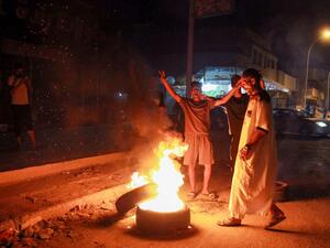 Libyan youth block a road with burning tyres in Libya's eastern coastal city of Benghazi on September 12, 2020, as they protest the poor public services and living conditions. Abdullah DOMA / AFP