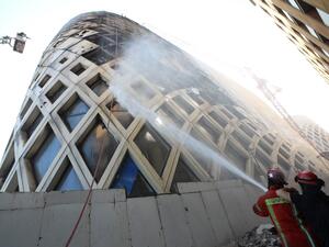 Lebanese firefighters douse the flames of a blaze that engulfed a landmark modern building, designed by the late world-renowned British-Iraqi architect Zaha Hadid, in central Beirut on September 15, 2020 The reasons behind the fire, which comes one week after another one at a Beirut port warehouse containing food, were not immediately known. ANWAR AMRO / AFP