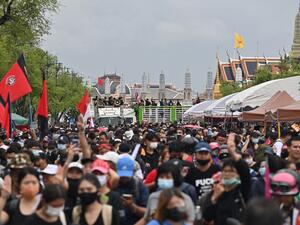 Anti-government protesters take part in a pro-democracy rally in Bangkok on September 20, 2020. Thousands of protesters cheered as activists installed a new plaque on September 20 declaring that Thailand "belongs to the people" -- the boldest show of defiance in a youth-led movement which has questioned the unassailable monarchy's role in the kingdom.  Lillian SUWANRUMPHA / AFP