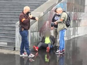 This grab taken from a video obtained by AFP shows French police detaining an alleged suspect after several people were injured near the former offices of the French satirical magazine Charlie Hebdo following an attack by a man wielding a knife in Paris on September 25, 2020. A man armed with a knife seriously wounded two people on September 25, 2020, in a suspected terror attack outside the former offices of French satirical weekly Charlie Hebdo in Paris, three weeks into the trial of men accused of being 