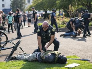 Police arrest a far-right protester after a clash with counter protesters during a rally on September 7, 2020 in Salem, Oregon. Nathan Howard / GETTY IMAGES NORTH AMERICA / Getty Images via AFP
