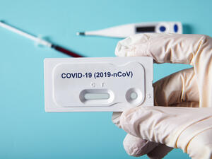 Doctor holding a test kit for viral disease COVID-19 2019-nCoV. (Shutterstock/ File Photo)