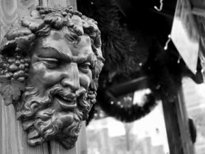 Bacchus (Dionysus) mask attached to the mulled wine stall at Christmas market in Paris (France). (Shutterstock/ File Photo)