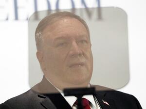 US Secretary of State Mike Pompeo is pictured through a teleprompter as he delivers remarks at a Holy See Symposium on Advancing and Defending Religious Freedom through Diplomacy on September 30, 2020 in Rome. US Secretary of State Mike Pompeo renewed an appeal on September 30, 2020 for the Vatican to take a stand against China, pushing a religious freedom theme used in President Donald Trump's re-election campaign. GUGLIELMO MANGIAPANE / POOL / AFP