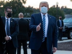 US President Donald Trump gives the thumbs-up as he leaves Walter Reed Medical Center in Bethesda, Maryland heading towards Marine One on October 5, 2020, to return to the White House after being discharged. Trump announced Monday he would be "back on the campaign trail soon", just before returning to the White House from a hospital where he was being treated for Covid-19. SAUL LOEB / AFP