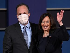 US Democratic vice presidential nominee and Senator from California, Kamala Harris (R) and husband Doug Emhoff stand onstage after the vice presidential debate in Kingsbury Hall at the University of Utah on October 7, 2020, in Salt Lake City, Utah. Robyn Beck / AFP