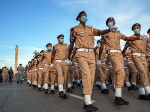 Security forces of Libya's UN-recognised Government of National Accord (GNA) march while mask-clad (COVID-19 coronavirus pandemic precaution) during an official parade commemorating "Police Day" at the Martyrs' Square in the GNA-held capital Tripoli on October 8, 2020. Mahmud TURKIA / AFP