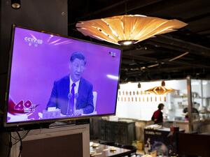 A television screen at a restaurant in Beijing shows Chinese President Xi Jinping speaking during a broadcast from Shenzhen at an event marking the 40th anniversary of the establishment of the Shenzhen Special Economic Zone, on October 14, 2020. on October 14, 2020.  NOEL CELIS / AFP