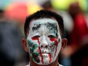 A pro-democracy protester takes part in an anti-government rally in Bangkok on October 14, 2020. Jack TAYLOR / AFP