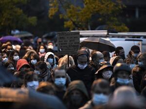 People attend the 'Marche Blanche' in Conflans-Sainte-Honorine, northwest of Paris, on October 20, 2020, in solidarity after a teacher was beheaded for showing pupils cartoons of the Prophet Mohammed. (AFP/File Photo)