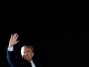 US President Donald Trump waves as he boards Air Force One following a Make America Great Again rally as he campaigns at Erie International Airport in Erie, Pennsylvania, October 20, 2020. SAUL LOEB / AFP