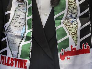 A member of the Neturei Karta movement, a small faction of anti-Zionist ultra-Orthodox Jews who oppose Israel's existence, wearing a scarf showing a map of historic Palestine with its Arabic city names and text in English and Arabic reading "Palestine", attends a demonstration in support of Palestinians held in Israeli prisons and hunger-striking detainee Maher al-Akhras in the centre of the flashpoint West Bank city of Hebron on October 21, 2020. The Palestinian on hunger strike for over 80 days since his 