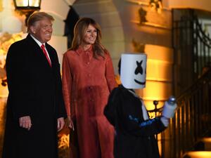 US President Donald Trump and First Lady Melania Trump greet trick or treaters during a Halloween celebration at the White House in Washington, DC, on October 25, 2020. (AFP)