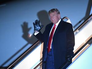 US President Donald Trump waves as he steps off Air Force One upon arrival at Andrews Air Force Base in Maryland on October 30, 2020. The President returns after a campaign rally at Rochester International Airport in Rochester, Minnesota. MANDEL NGAN / AFP