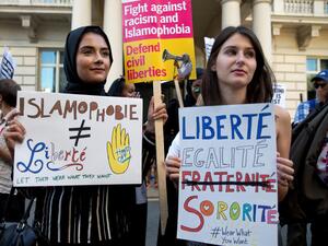 Women join a demonstration organised by "Stand up to Racism" outside the French Embassy in London on 26 August, 2016 against the Burkini ban on French beaches (AFP)