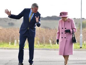 Britain's Queen Elizabeth II (C) speaks with Dstl Chief Executive Gary Aitkenhead (L) as she arrives at the Energetics Analysis Centre as they visit the Defence Science and Technology Laboratory (Dstl) at Porton Down science park near Salisbury, southern England, on October 15, 2020. The Queen and the Duke of Cambridge visited the Defence Science and Technology Laboratory (Dstl) where they were to view displays of weaponry and tactics used in counter intelligence, a demonstration of a Forensic Explosives In