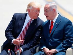 Israeli Prime Minister Benjamin Netanyahu and Trump speak after the U.S. president's arrival at Ben Gurion International Airport in Tel Aviv on Monday. (Jack Guez/AFP/Getty Images)
