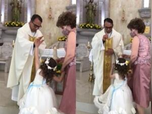 'Give me a high five, father': A little girl high-fived a priest as he was trying to give her a blessing. The priest struggled to contain his laughter after the adorable incident. (TikTok)