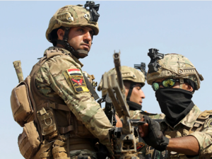 Iraqs rapid response forces storm a house in the Tarmiyah district, north of Baghdad, searching for wanted Islamic State group suspects on July 21, 2019. (Ahmad al-Rubaye/AFP via Getty Images)
