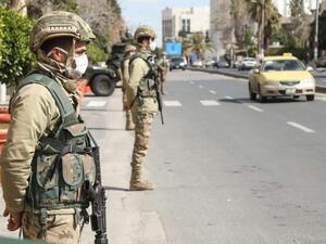 Jordanian army soldiers deployed at entrances and exits of main cities to enforce COVID-19 confinement measures. (AFP)