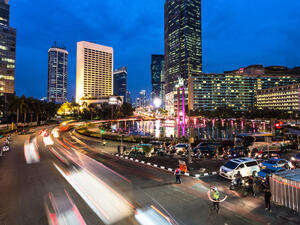 Traffic around Plaza Indonesia in Jakarta business district at night in Indonesia capital city.  (Shutterstock)	