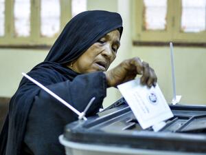 A woman voter casts her ballot at a polling station in Esna, about 55 kilometres south of Egypt's southern city of Luxor October 24, 2020, during the first stage of the lower house elections. Polling stations opened in Egypt for parliamentary elections in which there was little doubt of a sweeping victory for supporters of hardline President Abdel Fattah al-Sisi. Some 63 million voters out of Egypt's more than 100 million people are eligible to elect 568 of the 596 lawmakers in the lower house, widely seen 