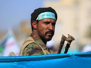A fighter loyal to Yemen's Huthi rebels stands guard during a ceremony marking the birth anniversary of Islam's Prophet Mohammad, known in Arabic as "Mawlid al-Nabawi", in the Yemeni capital Sanaa on October 29, 2020. MOHAMMED HUWAIS / AFP