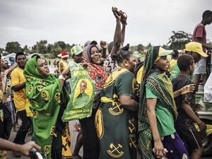Supporters of the ruling Chama Cha Mapinduzi (Revolutionary Party) celebrate the victory of their candidate in the Zanzibar Presidential election on the outskirts of Stone Town, on October 30, 2020. MARCO LONGARI / AFP