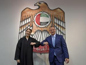 In this file photo taken on October 27, 2020, Emirati Minister of State for Food and Water Security Mariam al-Muhairi (L) and Erel Margalit, founder and chairman of Jerusalem Venture Partners (JVP), greet each other with an elbow bump at the headquarters of the Government Accelerators in Dubai. Karim SAHIB / AFP
