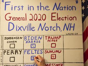 The votes are tallied, five in favor of Former vice-president and Democratic presidential nominee Joe Biden against zero for US President Donald Trump during the historic midnight vote at the Hale House at the historic Balsams Resort during midnight voting as part of the first ballots cast in the United States Presidential Election in Dixville Notch, New Hampshire on November 3, 2020. Voters in Dixville Notch, a village of 12 residents in the US state of New Hampshire, kicked off Election Day at the stroke 