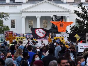 Demonstrators rally at Black Lives Matter plaza across from the White House in Washington, DC, on election day, November 3, 2020. Americans were voting on Tuesday under the shadow of a surging coronavirus pandemic to decide whether to reelect Republican Donald Trump, one of the most polarizing presidents in US history, or send Democrat Joe Biden to the White House. Olivier DOULIERY / AFP