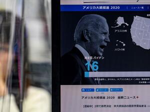 A news website shows a portrait of US presidential candidate Joe Biden at a foreign exchange trading company in Tokyo on November 4, 2020, as Asian markets react to early predictions following the US presidential election. Philip FONG / AFP
