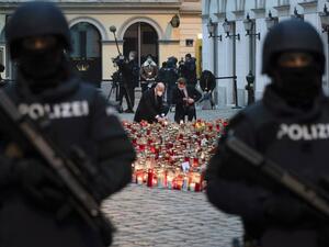 Austrian Chancellor Sebastian Kurz (R) and President of the European Council Charles Michel light candles as they pay respects to the victims of the recent terrorist attack in Vienna Austria on November 9,2020. JOE KLAMAR / AFP