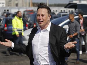 This file photo taken on September 3, 2020 shows Tesla CEO Elon Musk gesturing as he arrives to visit the construction site of the future US electric car giant Tesla, in Gruenheide near Berlin. The boom in demand for placing small satellites into orbit has boosted interest in small rockets, but industry players do not think the niche will become a business segment of its own. Odd ANDERSEN / AFP