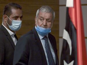 The chairman of the Libyan political accord committee, member of the High Council of State Bachir El Haouch (R), and the member of the founding committee of the Libyan constitution Abdelmonem El Sherif, arrive to hold a press conference on the UN-led Libyan talks, in the Tunisian capital Tunis, on November 14, 2020. FETHI BELAID / AFP