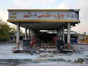  This file photo taken on November 17, 2019 shows a scorched gas station that was set ablaze by protesters during a demonstration against a rise in gasoline prices in Eslamshahr, near the Iranian capital of Tehran. One year after protests harshly suppressed by the Iranian authorities, grief over the hundreds of mainly young lives lost is matched by anger over the lack of accountability over a crackdown whose scale is only beginning to emerge. AFP