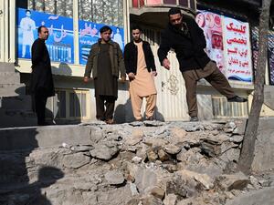 Residents gather at a site after several rockets land at Khair Khana, north west of Kabul on November 21, 2020. A series of loud explosions shook central Kabul on November 21, including several rockets that landed near the heavily fortified Green Zone where many embassies and international firms are based, officials said. WAKIL KOHSAR / AFP