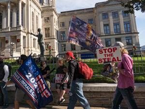 Supporters of Donald Trump host a 'Stop the Steal' protest outside of the Georgia State Capital building on November 21, 2020 in Atlanta, Georgia. Georgia finished the hand recount of ballots which confirmed President-elect Joe Biden's win in the state. Megan Varner/Getty Images/AFP