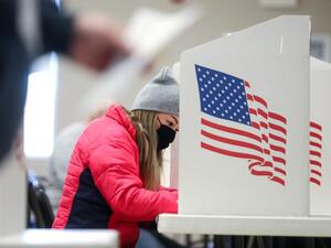 A voter marks her ballot at Bloomfield United Methodist Church on November 3, 2020 in Des Moines, Iowa. After a record-breaking early voting turnout, Americans head to the polls on Election Day to cast their vote for incumbent U.S. President Donald Trump or Democratic nominee Joe Biden in the 2020 presidential election. Mario Tama/Getty Images/AFP MARIO TAMA / GETTY IMAGES NORTH AMERICA / Getty Images via AFP