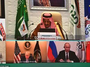 Pictured; President Trump (bottom left) was virtually seated next to Russian President Vladimir Putin during Saturday morning's G20 summit, which could be his last. (AFP/File)