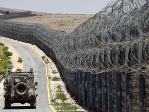 An Israeli army vehicle is seen driving along the road along the border fence separating the Israeli-annexed Golan Heights and Syria, on July 19, 2017. Photo by MENAHEM KAHANA/AFP via Getty Images.  Read more: https://www.al-monitor.com/pulse/originals/2020/08/israel-iran-syria-lebanon-hezbollah-golan-heights-undof-idf.html#ixzz6fC7zHOns