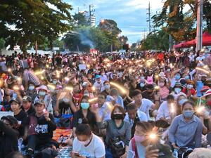 Anti-government protesters take part in a pro-democracy rally outside Thailand's parliament in Bangkok on 24 September, to demand a new constitution. Mladen Antonov / AFP