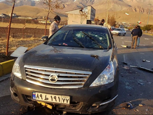 Pictures from the scene show a black car peppered with bullets and blood-soaked. (AFP)