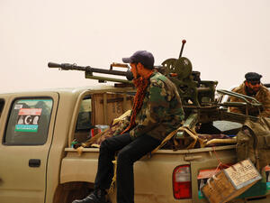 Libyan rebels travel to a battle line where they will fight Colonel Muammar Gaddafi's army. Ajdabiya, Libya. (Shutterstock/ File Photo)